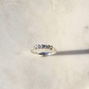five stone shared prong ring in sterling silver with moissanite, top view