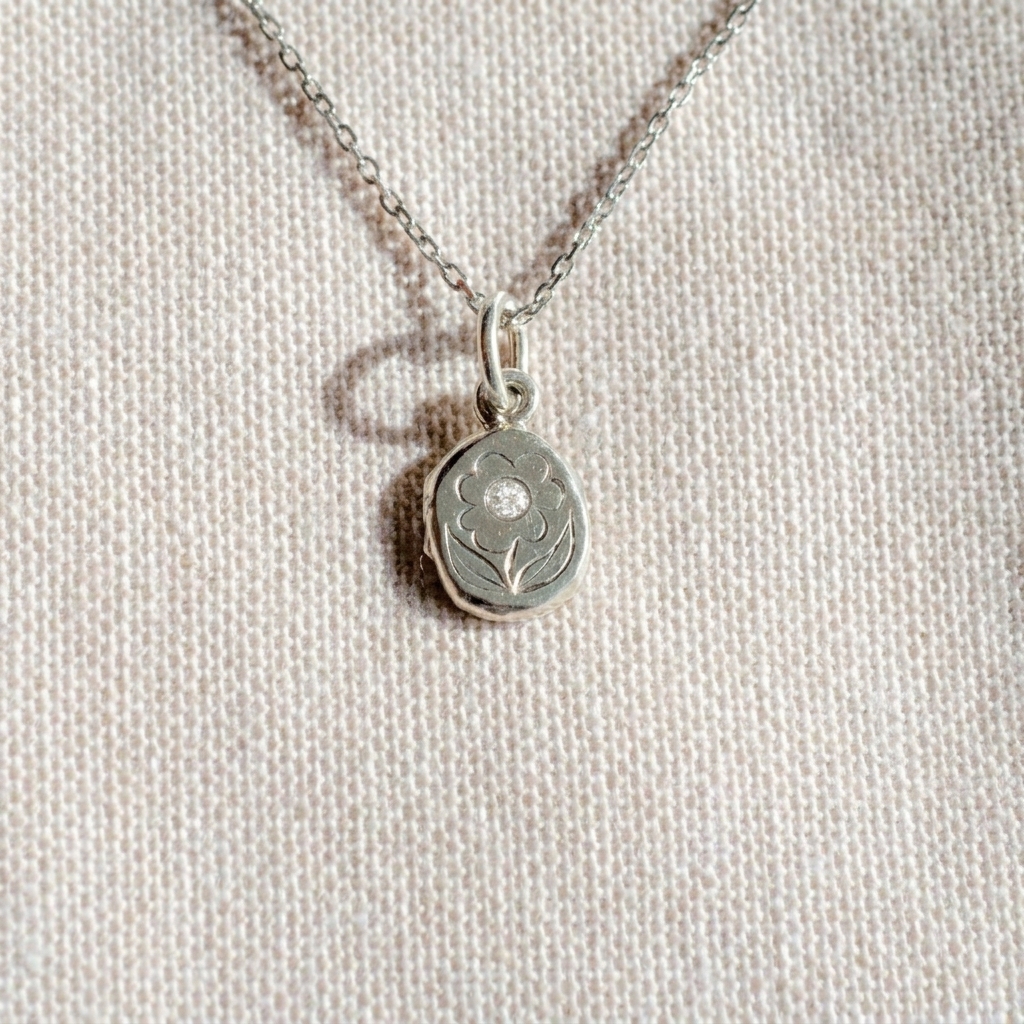 Posy Engraved Charm in sterling silver, hand engraved with a daily and set with a moissanite gemstone