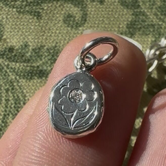 Hand engraved sterling silver posy charm